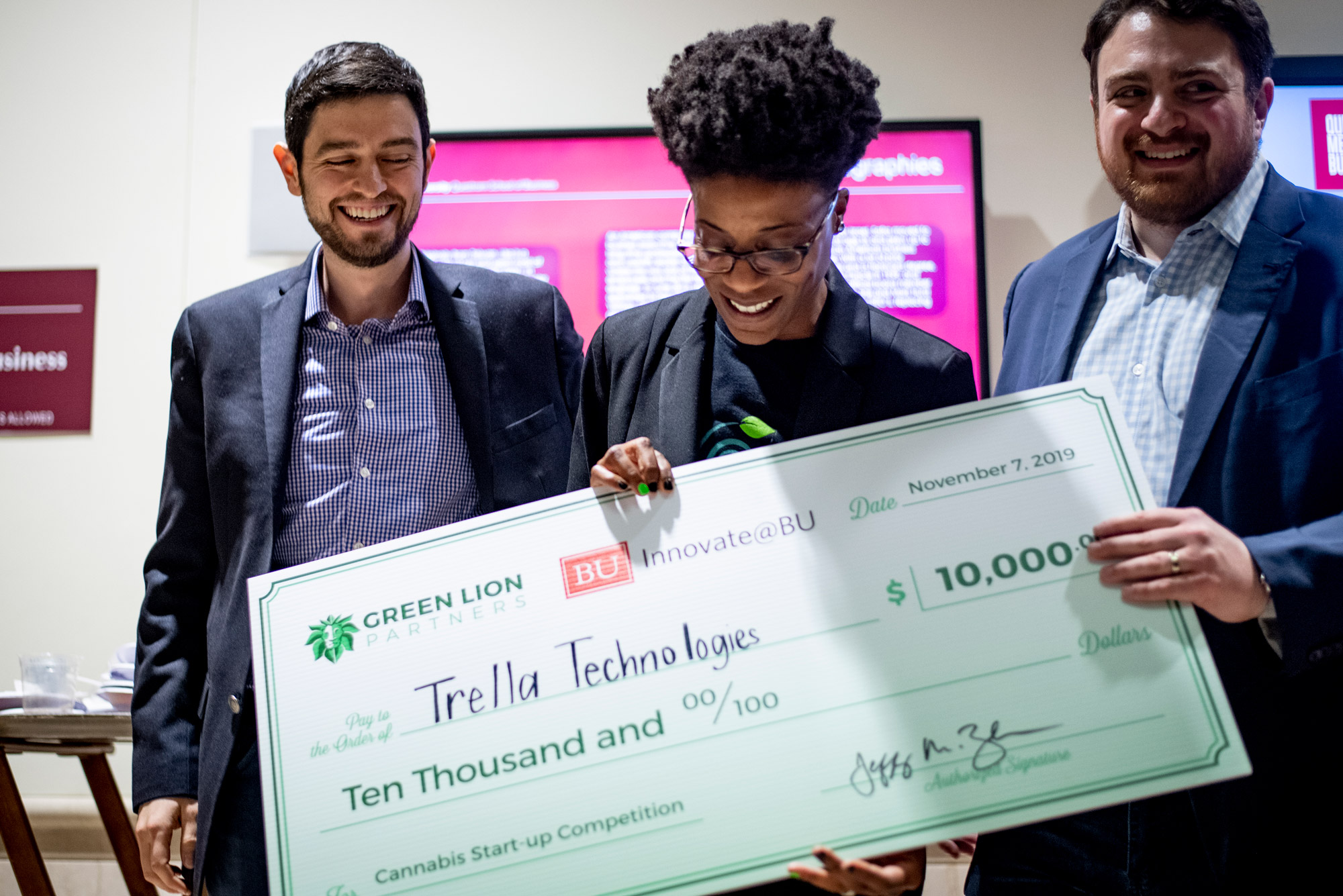 Angela Pitter (ENG'86) receives a check for $10,000 for her pitch for Trella Technologies, a horizontal plant-training system, during the 3rd Annual Cannabis Startup Competition