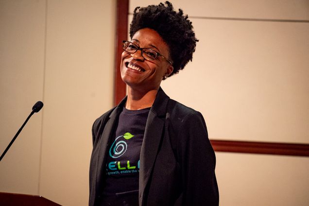 Winner Angela Pitter smiles as she receives a check for $10,000 for her pitch for Trella Technologies, a horizontal plant-training system, during the 3rd Annual Innovate@BU Cannabis Startup Competition.