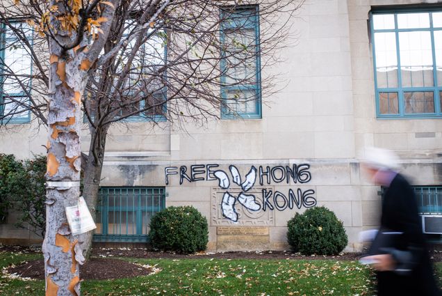 Graffiti on the CAS building spells out "Free Hong Kong"