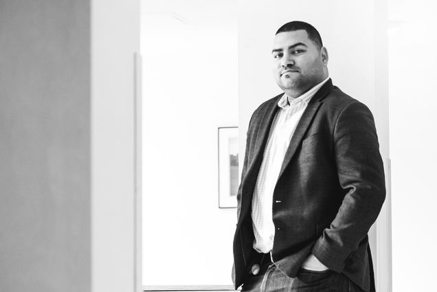 A black and white portrait of Raul Fernandez, BU Wheelock College associate dean for equity, diversity, and inclusion