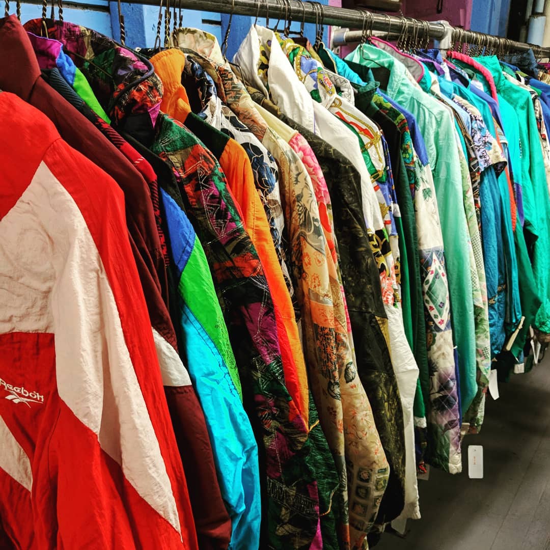 colorful jackets hanging in the Garment District consignment shop