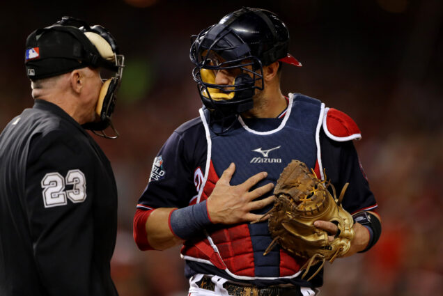 Yan Gomes #10 of the Washington Nationals argues a call with Home Plate umpire Lance Barksdale #23 during Game 5 of the 2019 World Series between the Houston Astros and the Washington Nationals