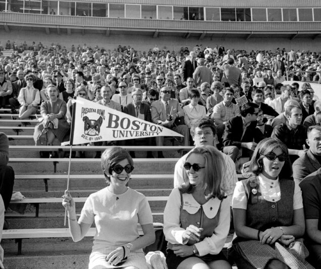 Boston University football fans wave a BU pennant in the crowd at Rose Bowl Stadium during the 1969 Pasadena Bowl game.