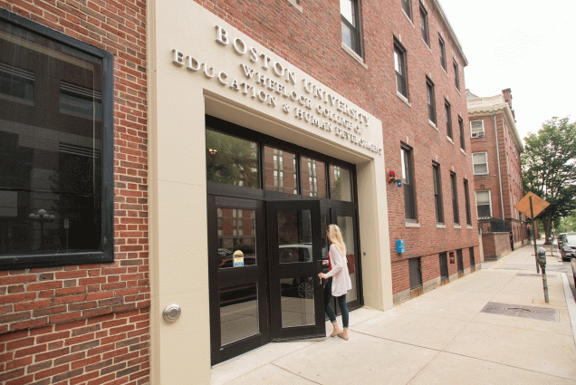 a woman walks into the Wheelock College of Education & Human Development at 2 Silber Way.