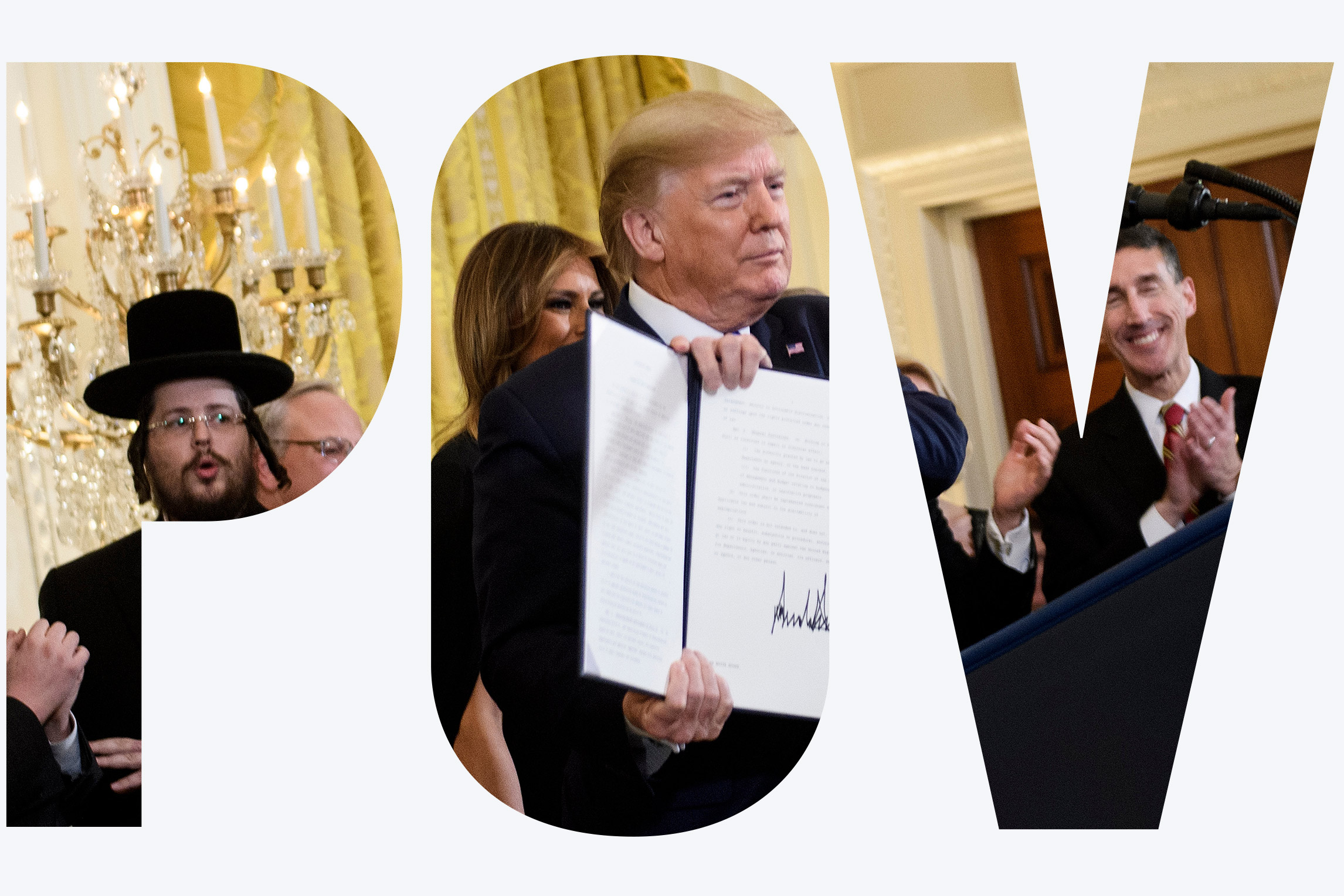 US President Donald Trump shows an executive order regarding anti-semitism during a Hanukkah reception in the East Room of the White House December 11, 2019, in Washington, DC.