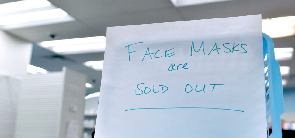 A photo of a sign in New York reading "Face Masks Are Sold Out"