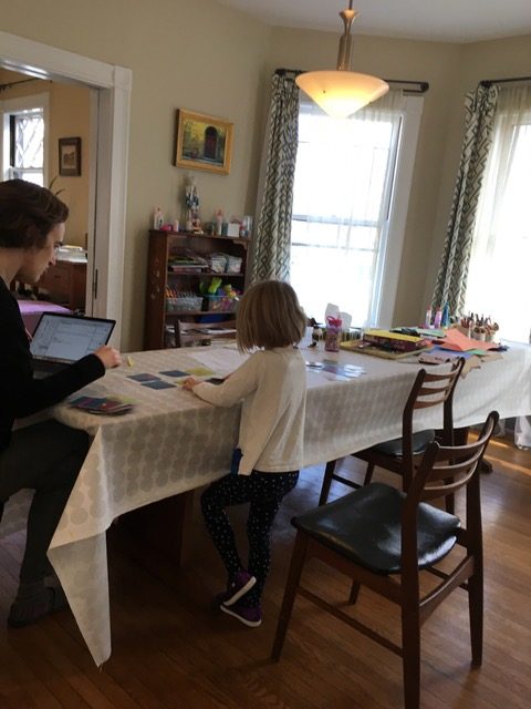 Eve Manz, Wheelock College assistant professor of education, works with her daughter at home.