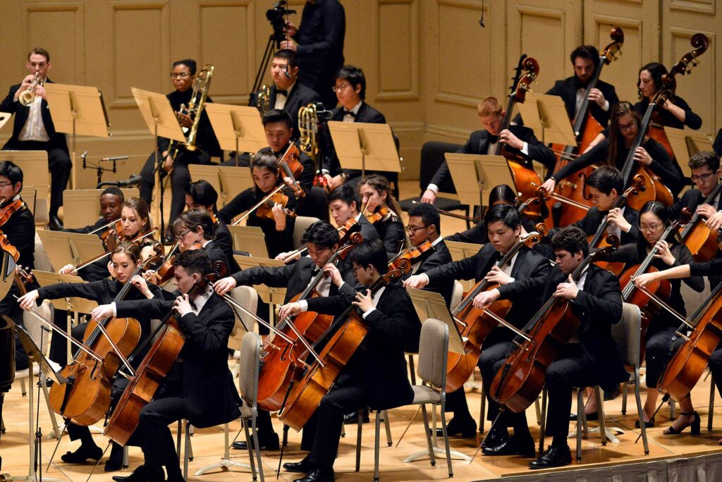 Photograph of the strings section of the Boston Philharmonic Youth Orchestra