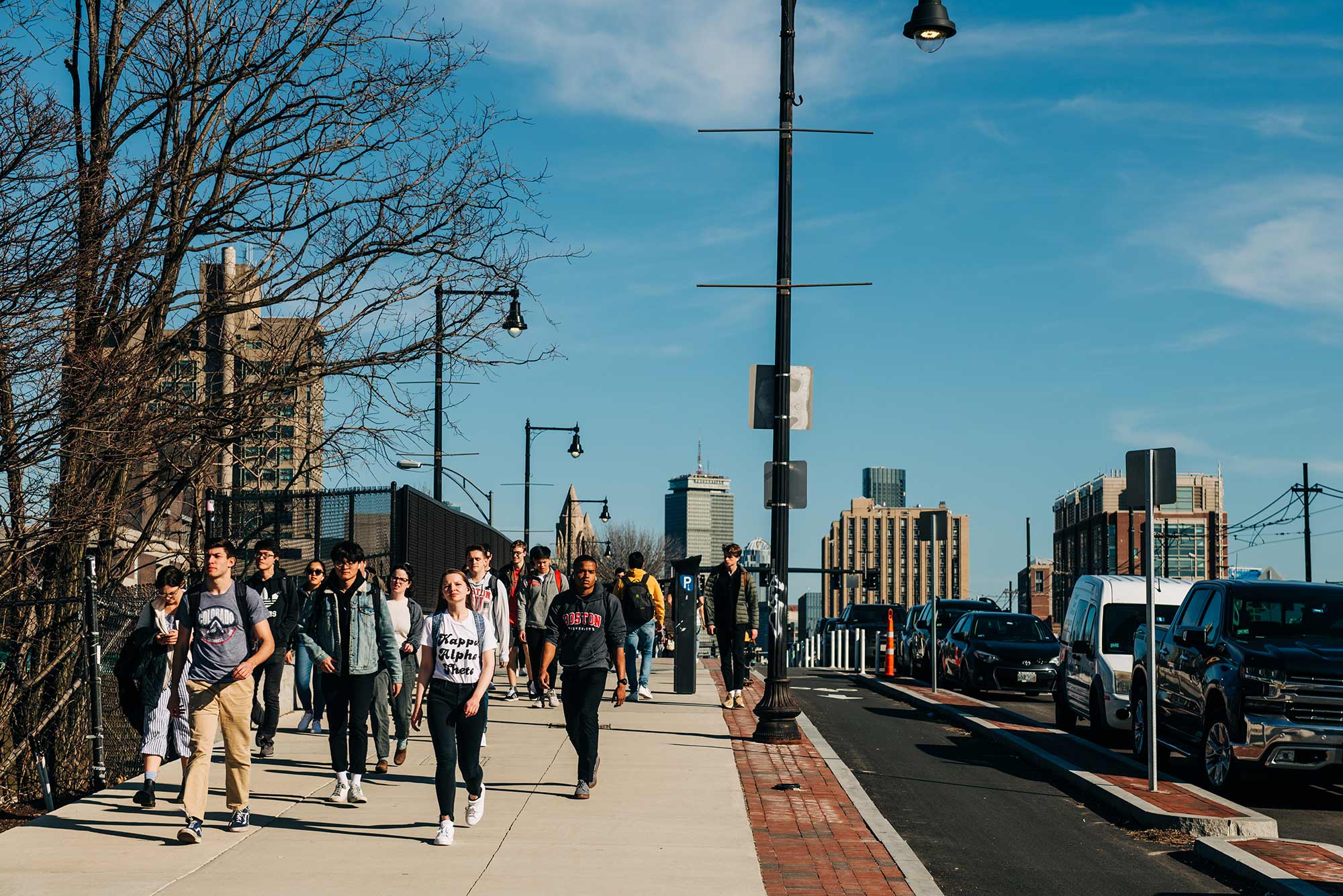 Photo of students walking along Comm ave in late February 2020.