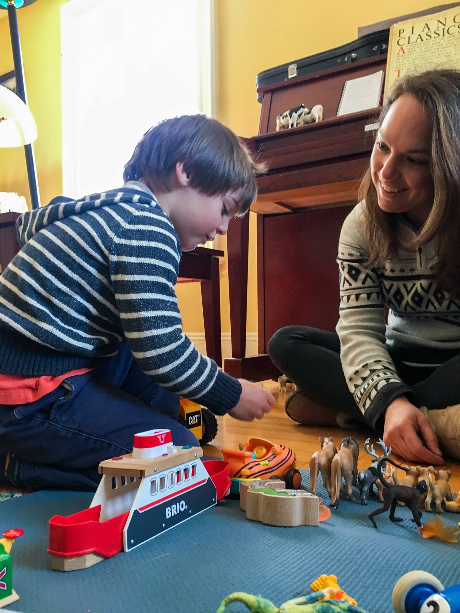 BU early childhood education lecturer Megina Baker plays with her 7-year-old son.
