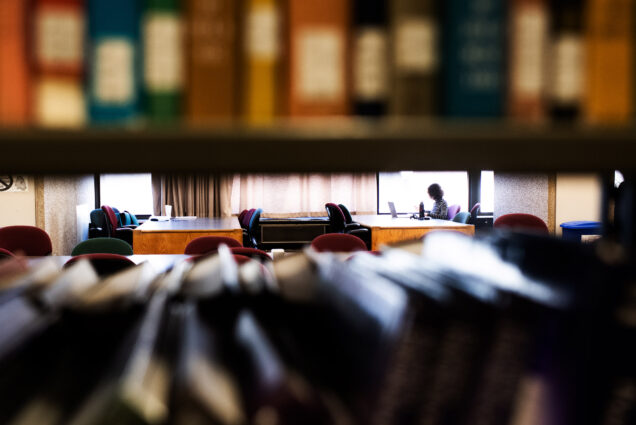 A photo of a student studying in Mugar library
