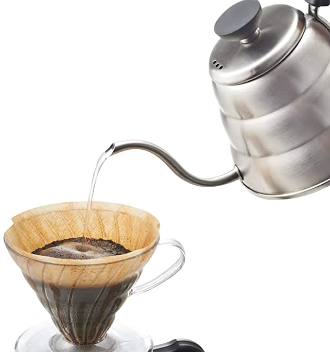 Image of Hario V60 Buono Pouring Kettle pouring hot water into a coffee pour over setup.