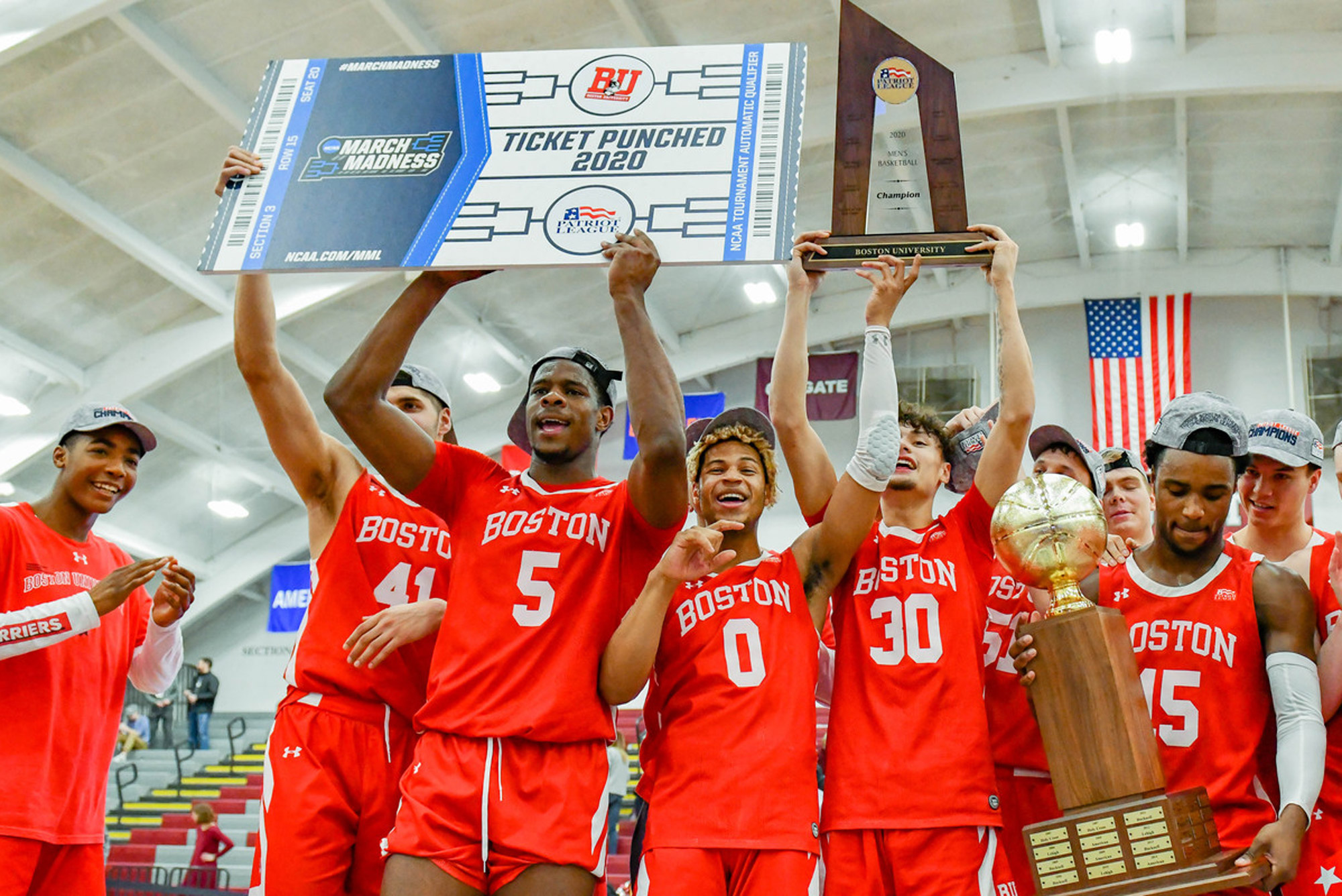 A photo of the BU Men's Basketball team after winning their first-ever Patriot League title last March