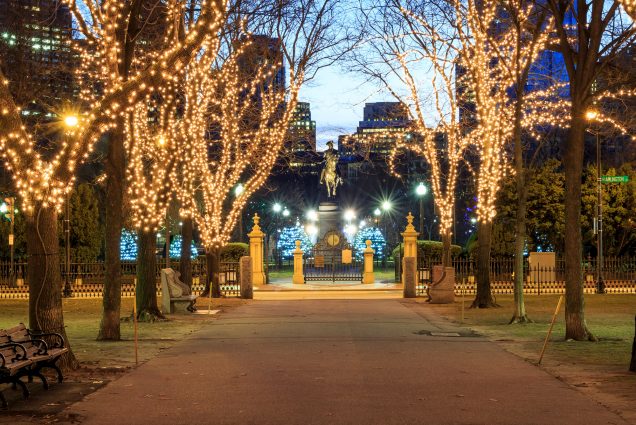 A photo of Boston Public Garden decked out with holiday lights