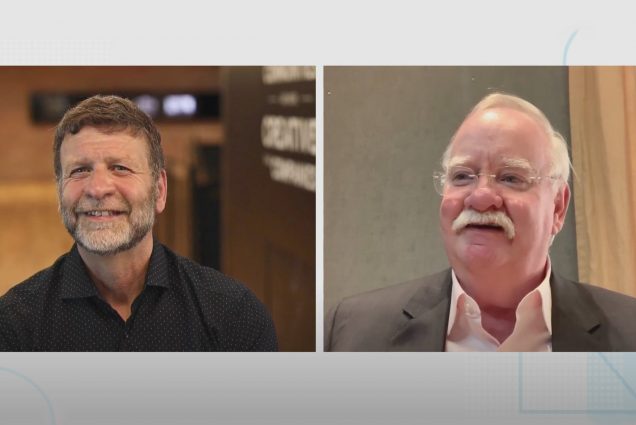 Screenshot of Paul Cormier, Red Hat president and CEO, left, and BU President Robert A. Brown discussing the potential rewards of the extended partnership in a Zoom meeting. Both men smile and look towards the camera.