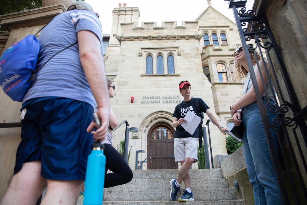 Students from the course, the history of Boston University Abin George (ENG’23) (center) Jonathan Brett (right) School of Education of Wheelock’21 from the course, the History of Boston University, check out the Dahod Family Alumni center, a small castle-looking building in white.