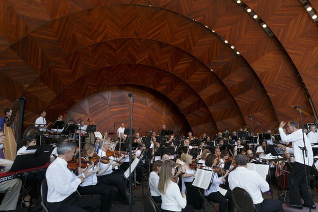 Boston Landmarks Orchestra performing at the DCR Hatch Shell on the Boston Esplanade.