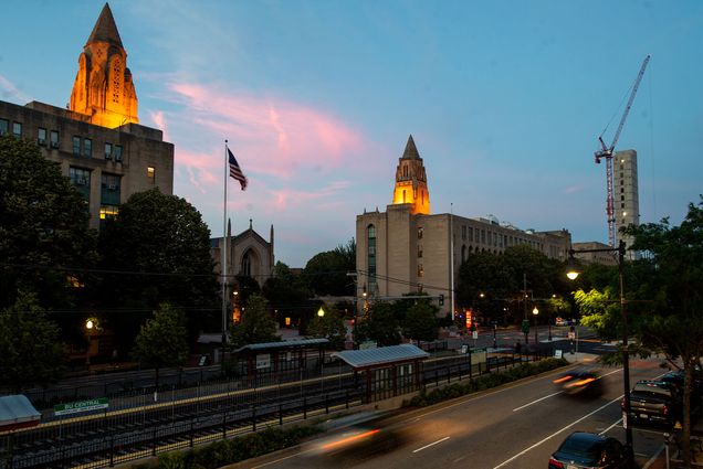 Boston University's Charles River Campus at Dusk near Marsh Plaza as traffic rushes by and then sun sets