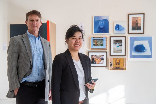 Emily Lam (ENG'14,'16,'20) and ENG Professor Thomas Little started tech company Rtangent, whose technology provides virtual tours led by a a live interpreter/guide. They were photographed at Gallery 263 in Cambridge, for which they created a tour. Photo by Cydney Scott for Boston University Photography