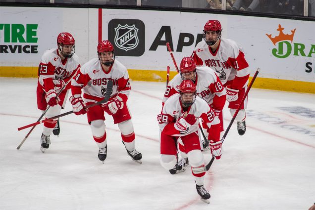 Ethan Phillips (CAS’23) (foreground) leads teammates to the bench after scoring what was the eventual game-winning goal against Harvard during the 69th annual Beanpot Hockey Tournament’s first semifinal game February 7 at TD Garden.