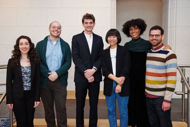 Photo of this year’s Kahn winners (from left): Savannah Panah (CFA’22), music and vocal performance (from left), Devon Russo (CFA’22), music and vocal performance, grand prize winner Gavin Fahey (CFA’22), painting, Chen Peng (CFA’22), painting, Mya Ison (CFA’22), theater arts and performance, and Noah Putterman (CFA’22), directing. A group of students dressed in business casual wear stand in a line and pose for the camera.