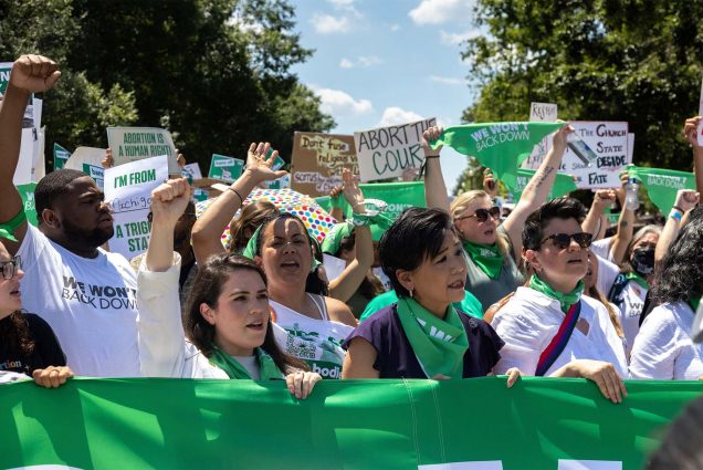Demonstrators with Center for Popular Democracy and other organizations perform a mass civil disobedience in support of abortion access by sitting and blocking an intersection near the Supreme Court in Washington, D.C. on June 30, 2022. (Photo by Bryan Olin Dozier/NurPhoto via AP)