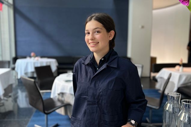 Jami Sachs stands in all black in the dining room of The Modern at MOMA