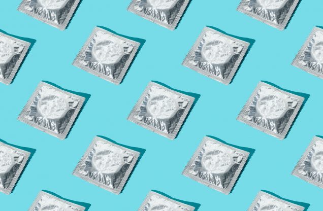condoms in packaging on a aqua background