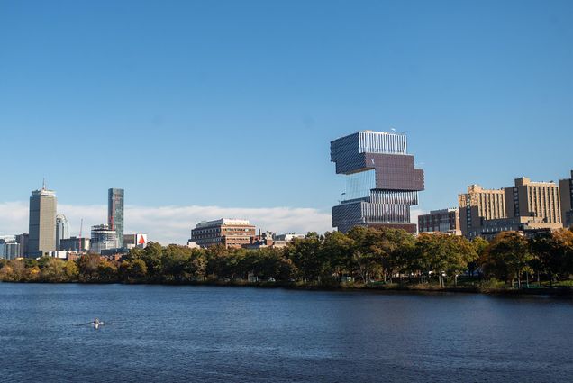 Photo: A photo of the CCDS on Boston University's campus. It is shown from across the Charles River, among the Boston skyline.