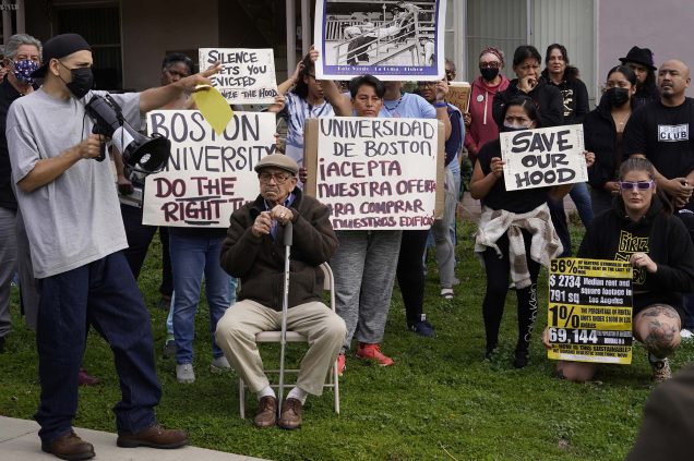 Tenant Jose Lopez (far left) spoke to a rally last month in opposition to his BU-owned apartment buildings in Los Angeles being sold to a private investor; the University has agreed tentatively to sell the structure and three others to a trust representing the tenants. Photo by AP/Damian Dovarganes