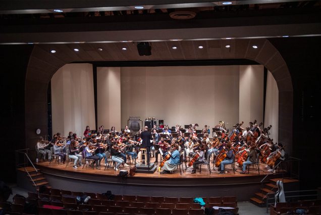 3/30/22 -- Boston, MA BU orchestra practices in the Tsai Performance Center led by James Burton, Director of Orchestral Activities and Master Lecturer, Music. The orchestra will be performing at Symphony Hall April 5. Photo by Cydney Scott for Boston University Photography
