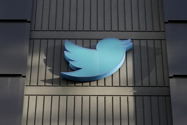 Photo: Front exterior of the Twitter headquarters is shown in San Francisco is shown. the large, light blue twitter logo is shown on a dark brown building.