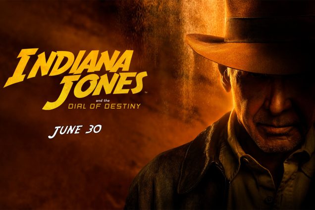 Photo: Poster for the film "Indiana Jones and the Dial of Destiny". Text reads "June 30". A man in a cowboy hat (Indiana Jones played by Harrison Ford) stares down the camera. The image has a red hue overall.