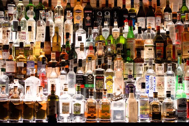 Photo: A fully stocked bar with dozens of different bottles of hard alcohol.