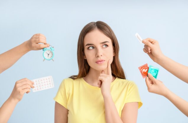 A woman being presented with different forms of contraception. She is thinking, with a finger to her chin. Photo courtesty of canva.com