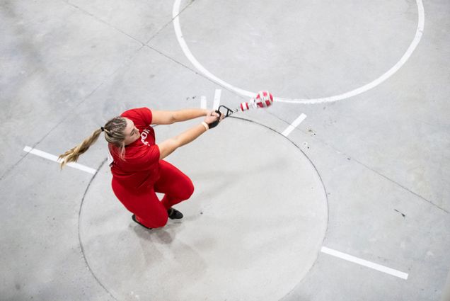 Photo: A college athlete swings a shotput at a recent track meet at Boston University