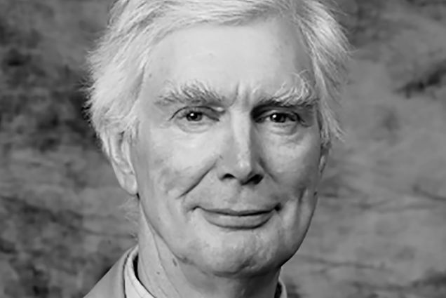 Photo: A black and white photo of David Anable, a white man with white hair wearing a suit.