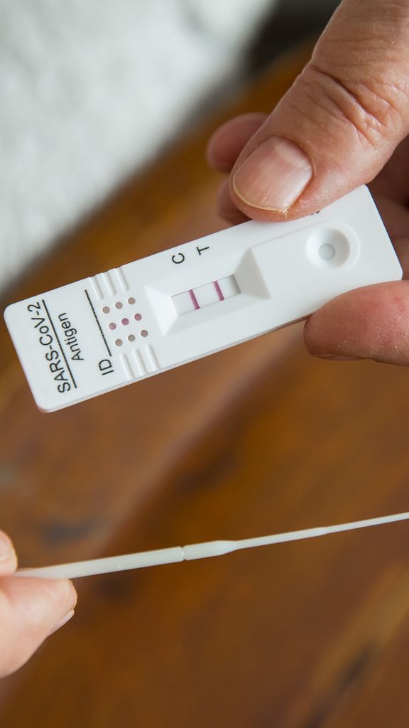 Photo: A stock image of a individual taking a COVID test.