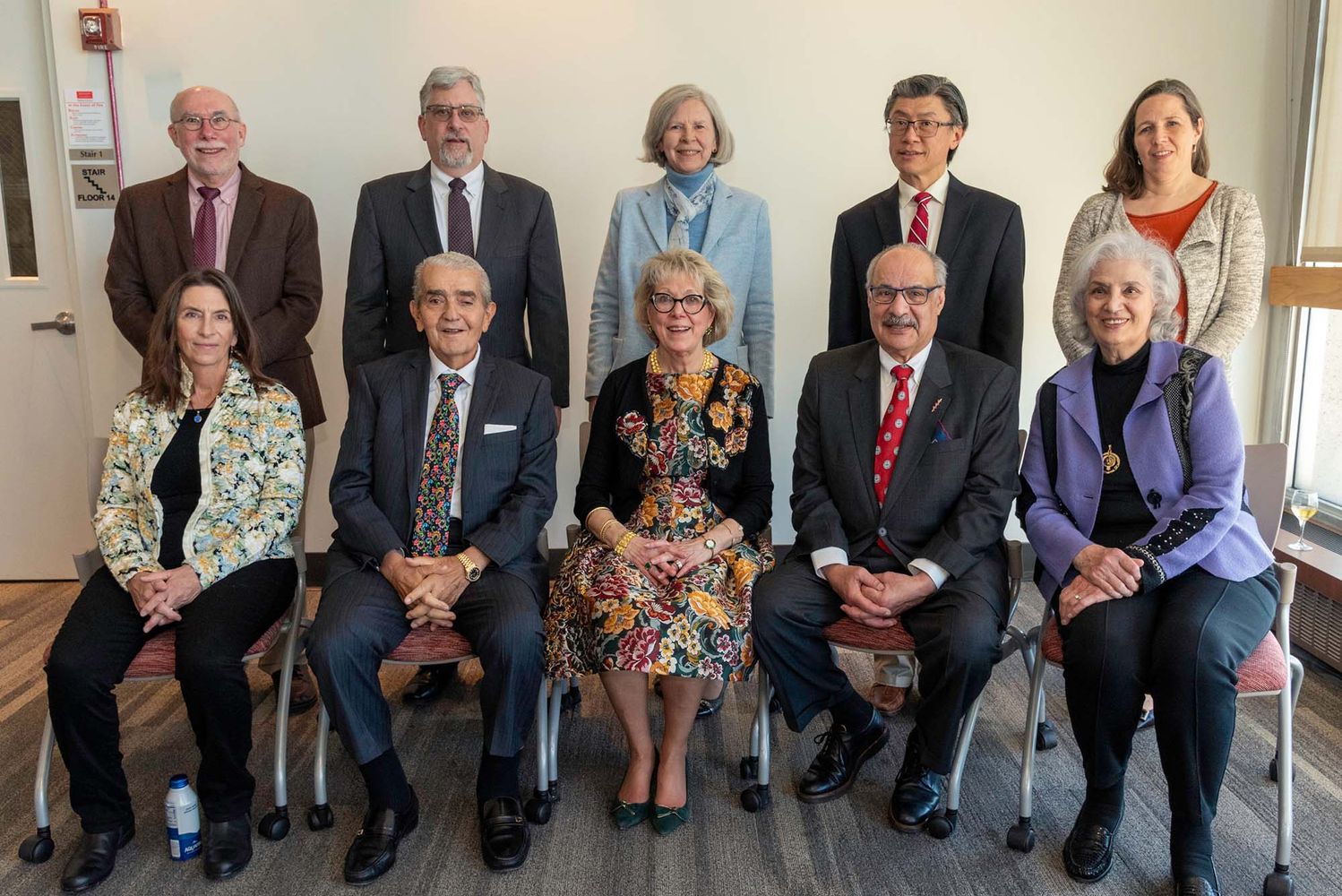 Photo: A large group of elegantly dressed individuals posing for a photo at a recent event on Boston University's medical campus