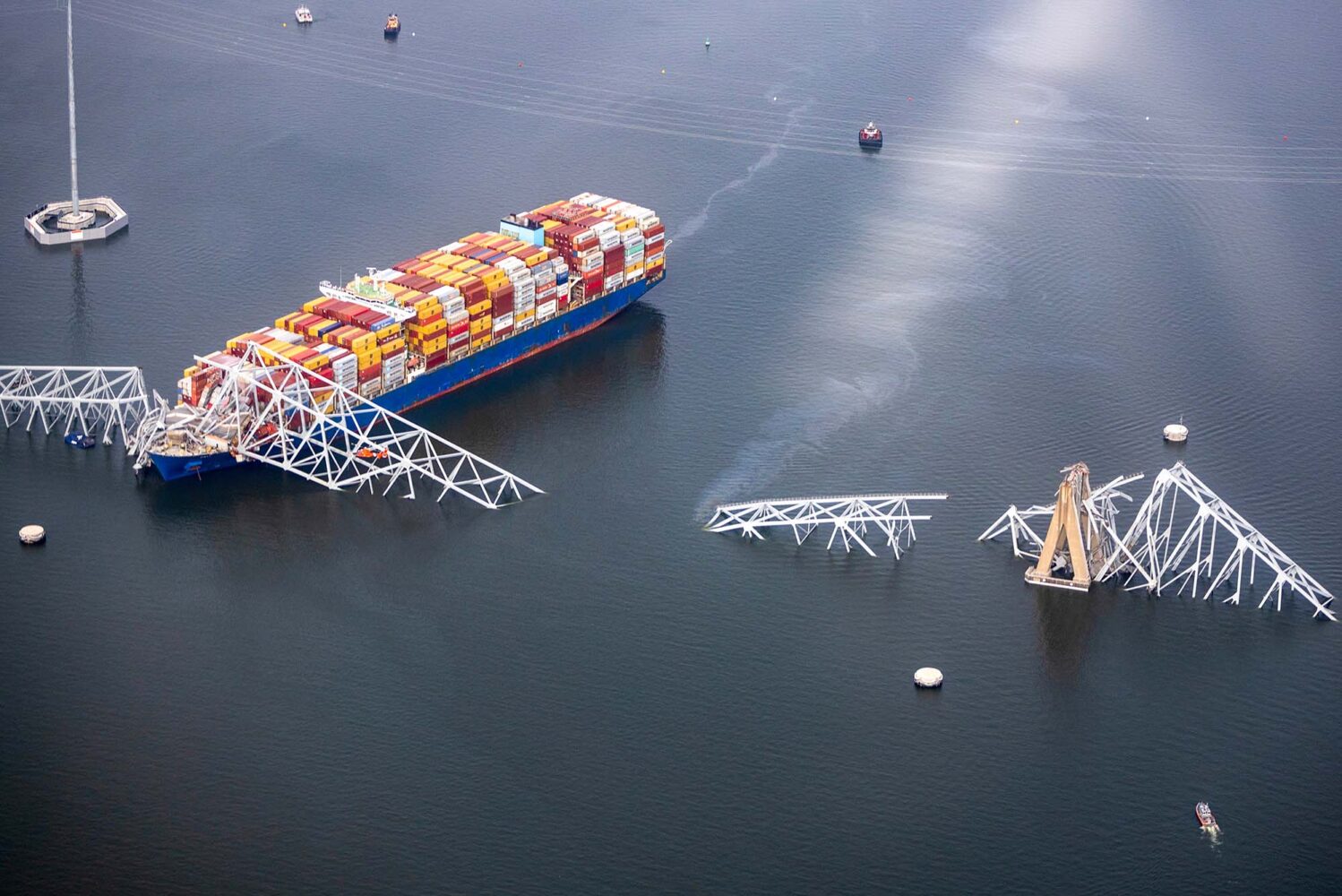 Photo: An aerial view of a container ship resting in the wreckage of the Francis Scott Key Bridge