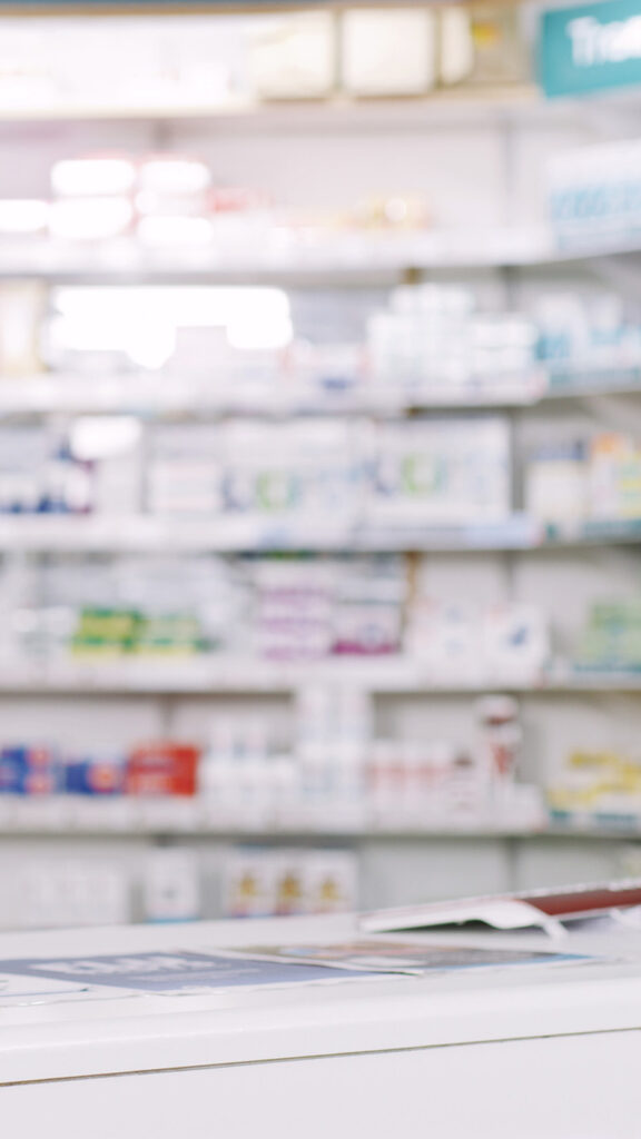 Photo: A stock shot a pharmacy, vacant of people. Shot of shelves stocked with various medicinal products in a pharmacy.