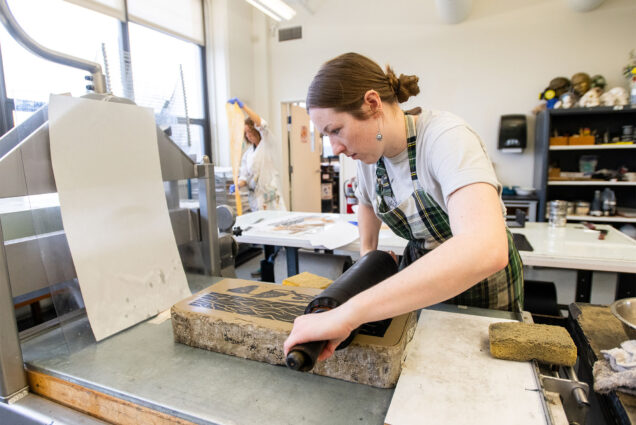 Emily Taylor Rice (CFA’21,’24) and Delaney Burns (CFA’24), both grad students in the College of Fine Arts Print Media & Photography program, working on their respective thesis projects ahead of the School of Visual Arts graduate thesis exhibitions. Photo by Cydney Scott