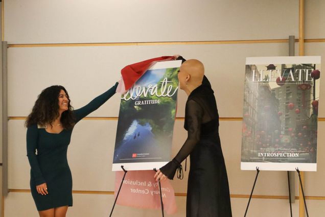 Photo: Valerie Sanchez Covaleda (CAS '24)(left) and Katarina Quach (COM '24), the co-editors-in-chief unveil the cover of the third issue of Elevate, the magazine associated with the Newbury Center,.