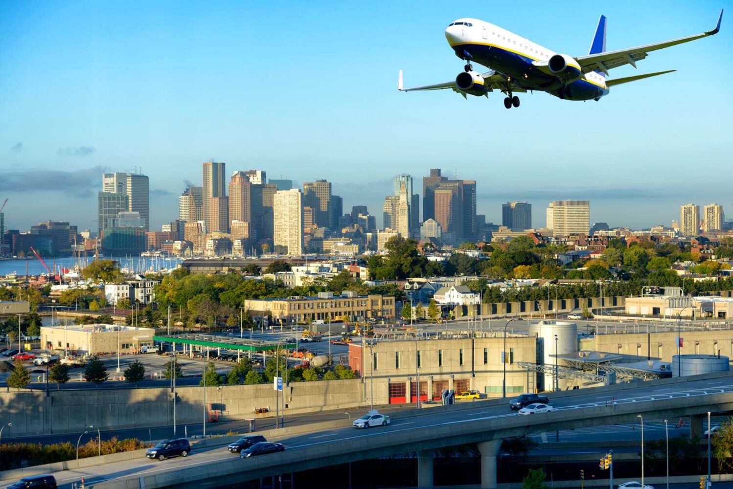 Photo: A picture of a plane flying away from a city landscape