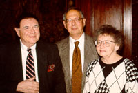 hist-engelbourg At the reception given for Professor Saul Engelbourg on his retirement (at left, Dr. Howard Gotlieb, Director of Special Collections; at right, Prof. Engelbourg’s wife Charlotte).