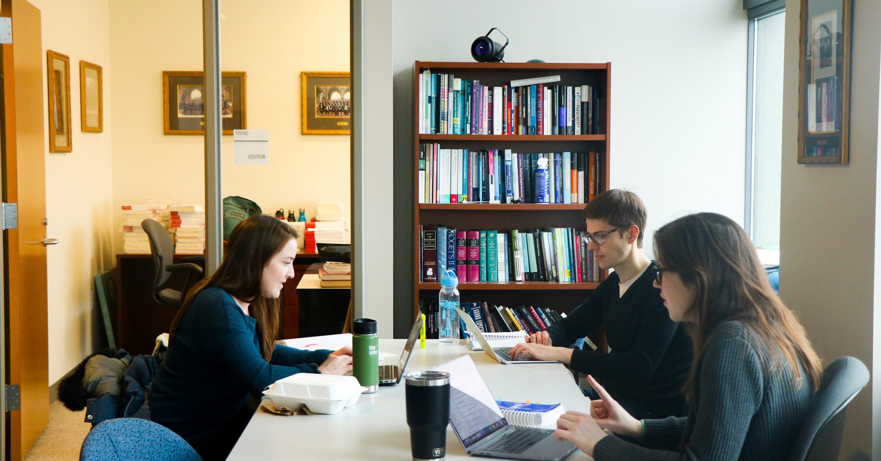 Students working in law review office