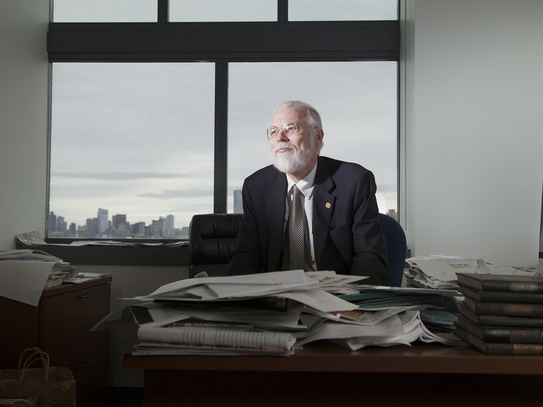 Professor David J. Seipp sits in his office surrounded by books and papers