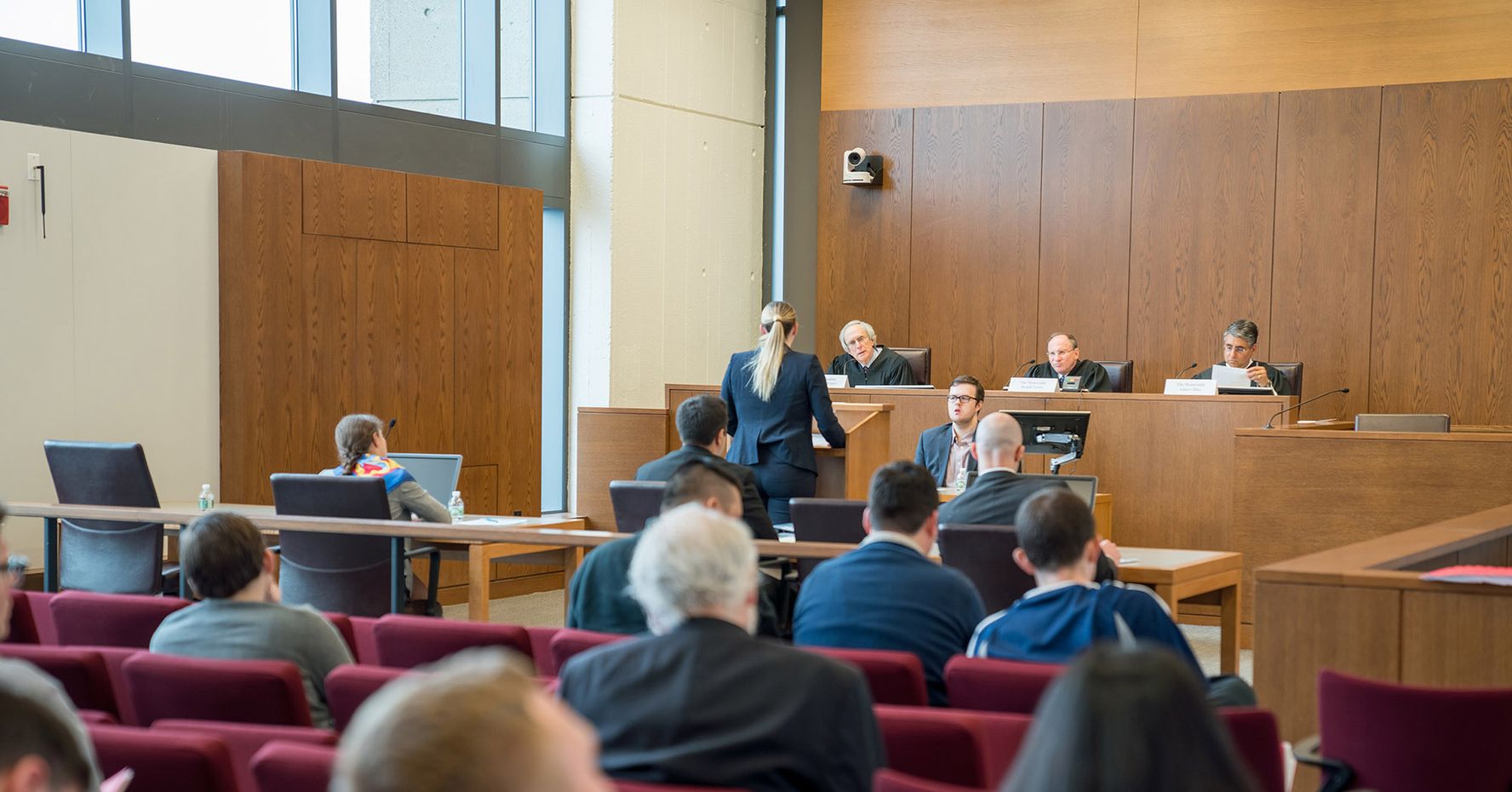 Students practice trying a case in the courtroom at BU Law.