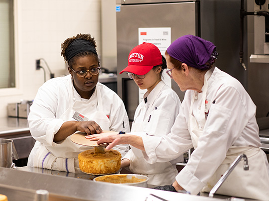 Kayla Tabb talking with students in Pastry Arts Program at Boston University.