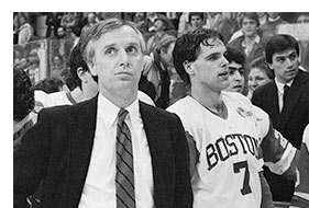 s13quinn1 David Quinn, right #7, stands next to Boston University men's hockey head coach, Jack Parker, after a 4-1 victory over BC during the 1986 Beanpot tournament at the Boston Garden. Photo by Boston University Photography